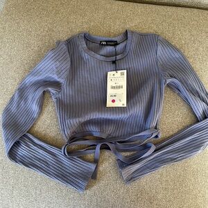 Zara top size s. Tide at the back